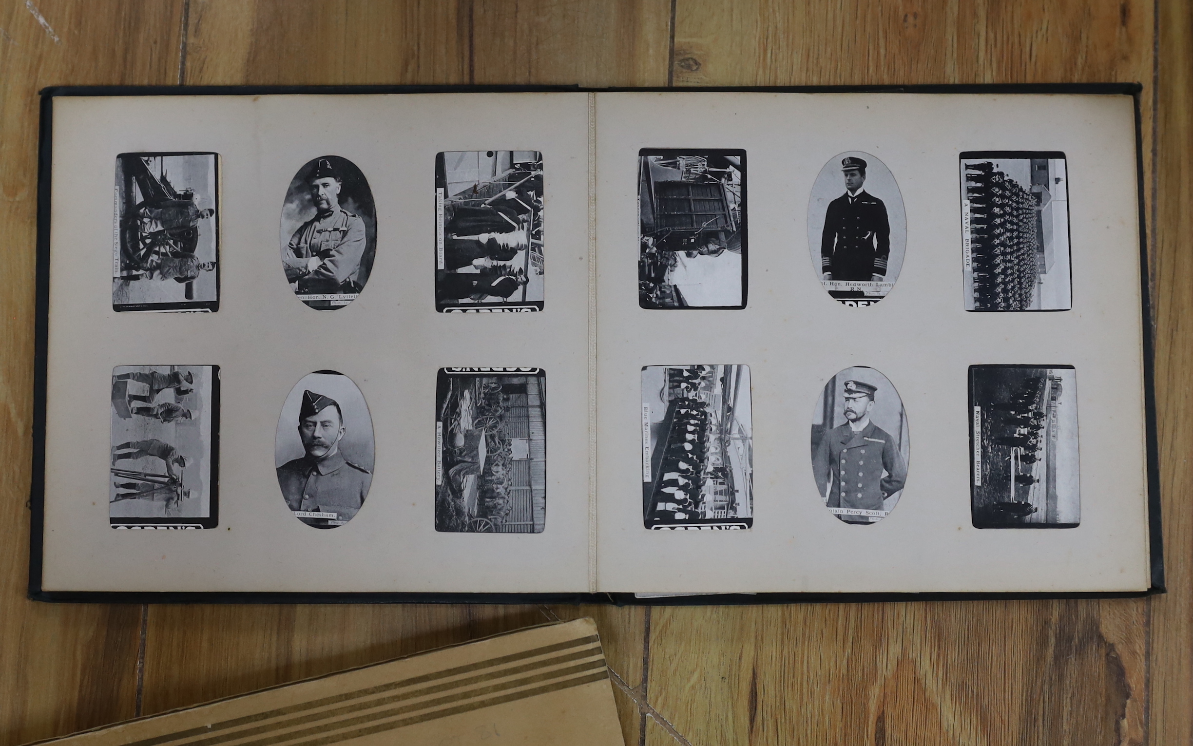 A collection of cigarette cards in albums